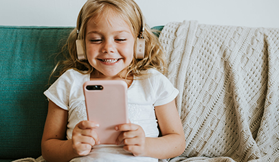 Full shot of girl playing on phone