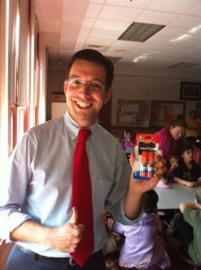 teacher holding school supply gifts