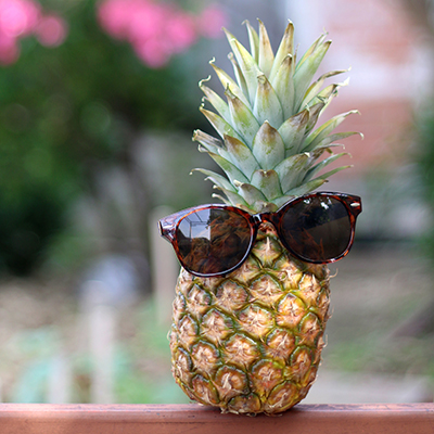 a pineapple with a pair of sunglasses on
