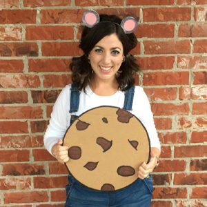 Woman wearing mouse costume holding a cookie