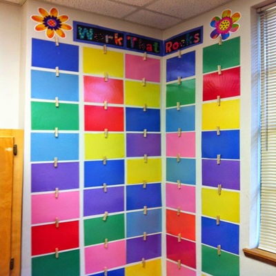 Wall of student work on colored paper