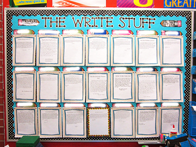 bulletin board with student's writings displayed