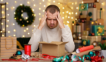 Stressed man with holiday gift