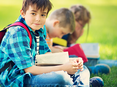 Students Reading Outdoors